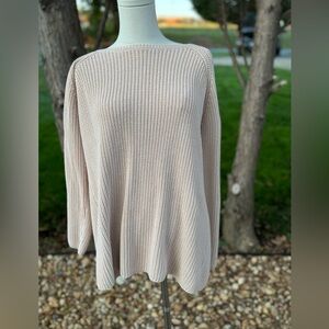 Cream oversized knit sweater with a relaxed fit, featuring a ribbed texture